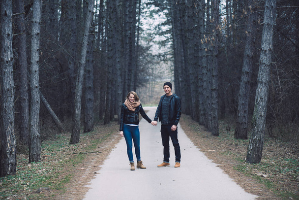 Loving couple in forest. Happy couple in love posing outdoor. - Photo, image
