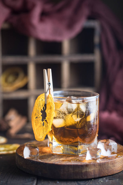 Cocktail with iced tea, whiskey and orange - Photo, image