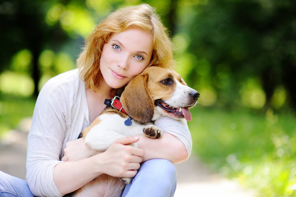 Young woman with Beagle dog in the park - Fotografie, Obrázek
