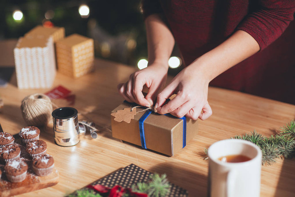 Woman Wrapping Christmas Present - Foto, Imagen
