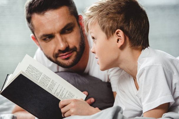 Father and son reading book   - Photo, Image