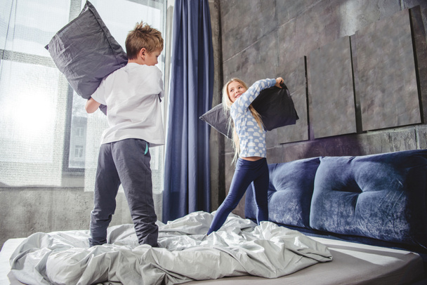 Siblings fighting with pillows - Photo, Image
