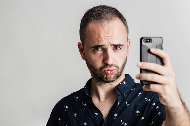 Young amusing male getting selfie - Photo, Image