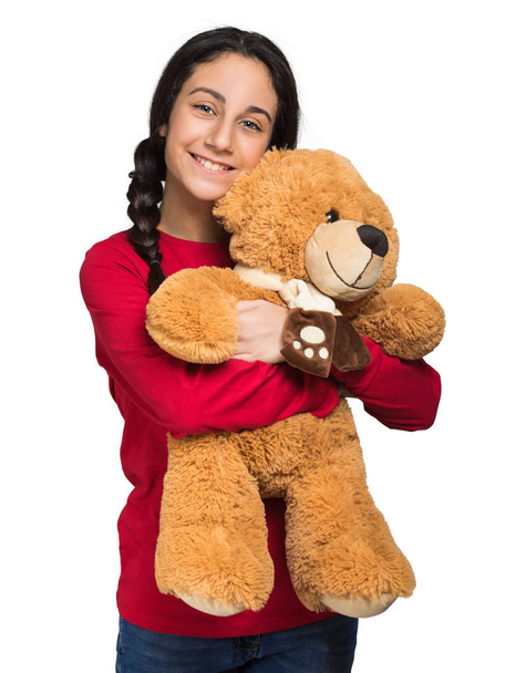 Smiling girl holding teddy bear - Фото, зображення