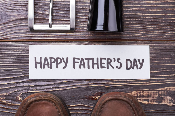 Fathers Day card near shoes. - Photo, image