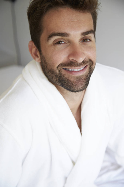 Smiling man in robe - Фото, изображение