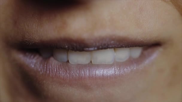 Extreme close up of woman biting her lower lip - Footage, Video