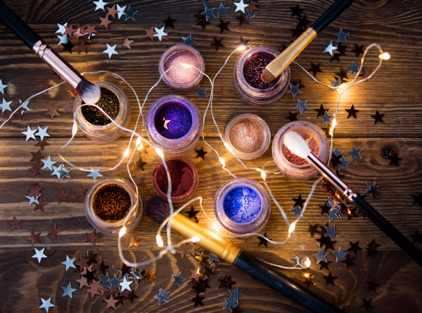 Present makeup cosmetics and fairy lights - Photo, Image