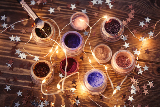 Present makeup cosmetics and fairy lights - Photo, Image