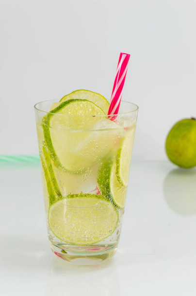 Cold green lime juice with ice cubes - Photo, Image