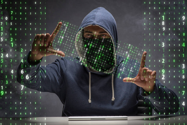 Young hacker in data security concept - Photo, Image