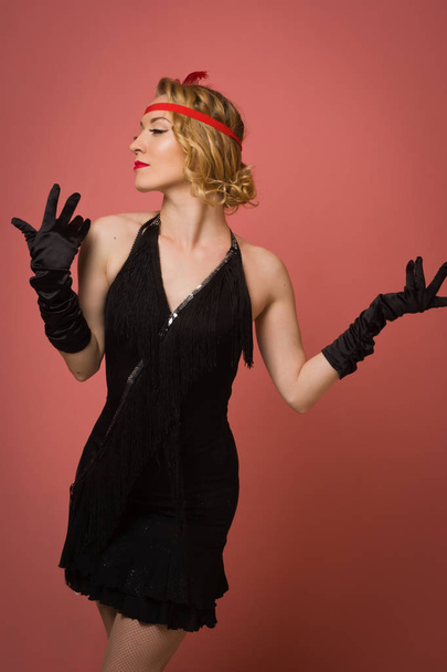 pretty actress in black retro dress with headband - Fotoğraf, Görsel