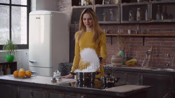 Woman preparing dinner in apartment. - Video, Çekim