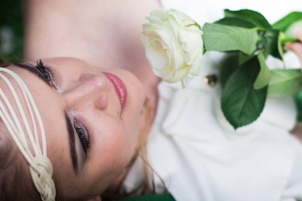 beautiful girl with white rose - Фото, изображение