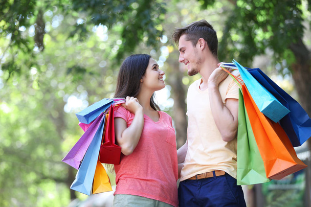 Happy couple with shopping bags   - Fotó, kép
