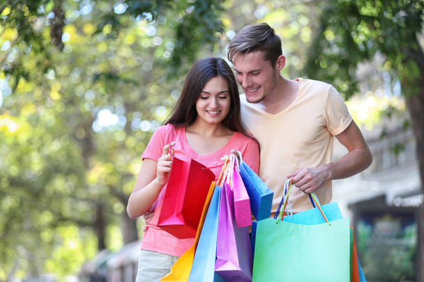 Happy couple with shopping bags   - Foto, Imagem