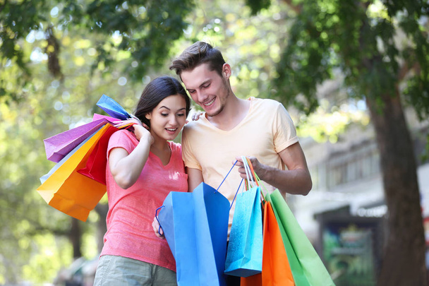 Happy couple with shopping bags   - Foto, Imagem