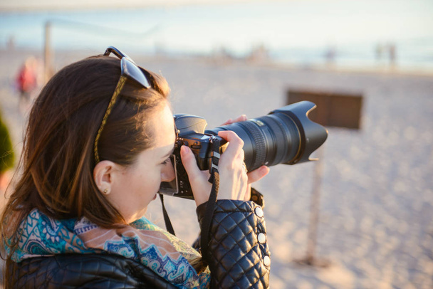 professional woman photographer on the beach - Photo, Image