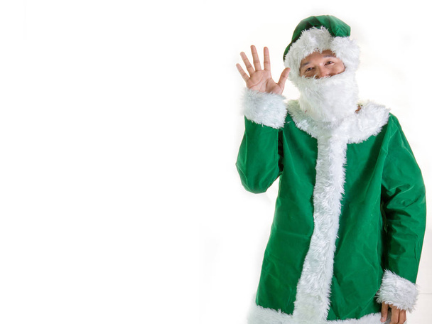 Санта-Клаус в зеленом костюме с сумкой
 - Фото, изображение