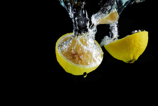 Slice of lemon with water drops - Photo, image