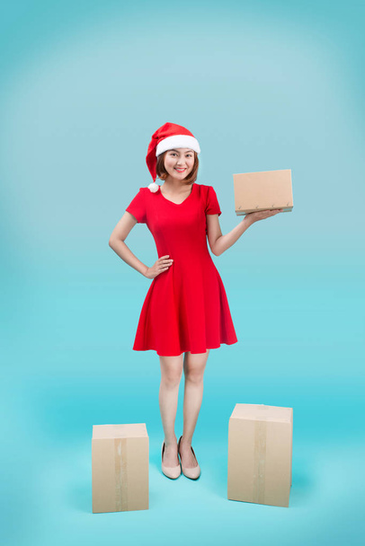 Asian Woman hold christmas carton gift box - Photo, Image