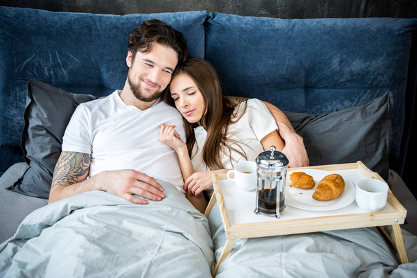 Couple has breakfast in bed - Photo, Image