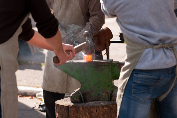 men forge on the anvil - Photo, Image