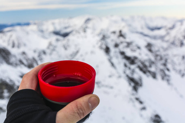 Cup of tea in the winter in the mountains. - Photo, Image