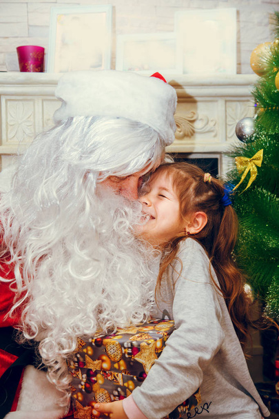 Santa Claus and little girl. - Fotoğraf, Görsel