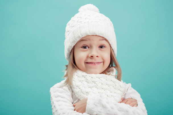 portrait of a little  girl in white hat and scarf - Фото, изображение