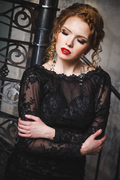 sensual young lady in a black evening dress with naked back - Fotografie, Obrázek