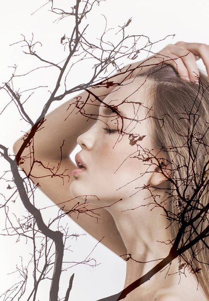 Double exposure of beautiful girl profile portrait and autumn branches - Photo, image