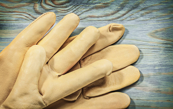 Pair of leather protective gloves - Φωτογραφία, εικόνα