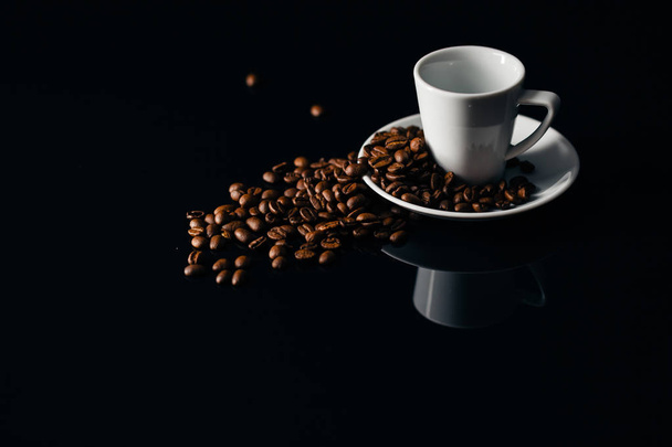Overturned white mug with coffee beans - Photo, image