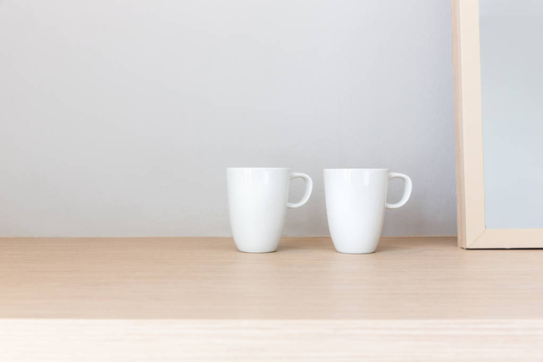 White cups on wooden bar table with blank space for text - Foto, Imagem