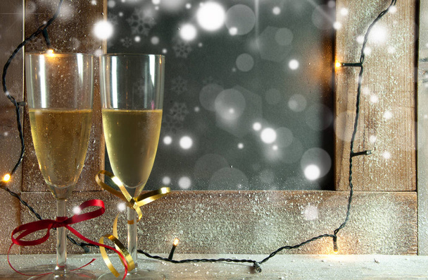 Champagne glasses next to blackboard  - Photo, Image
