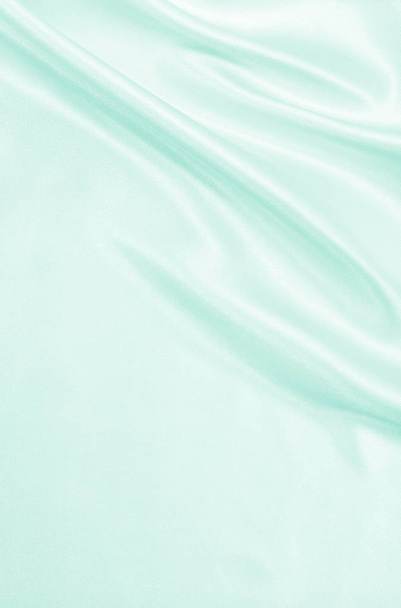 Smooth elegant green silk or satin luxury cloth texture as abstr - Фото, изображение