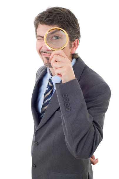 Isolated young business man with magnifying glass - Foto, Bild
