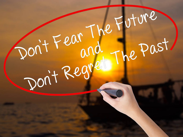Woman Hand Writing Don 't Fear The Future and Don' t Regret The Pa
 - Фото, изображение