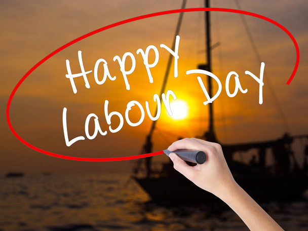 Woman Hand Writing Happy Labor Day with a marker over transparen - Photo, Image