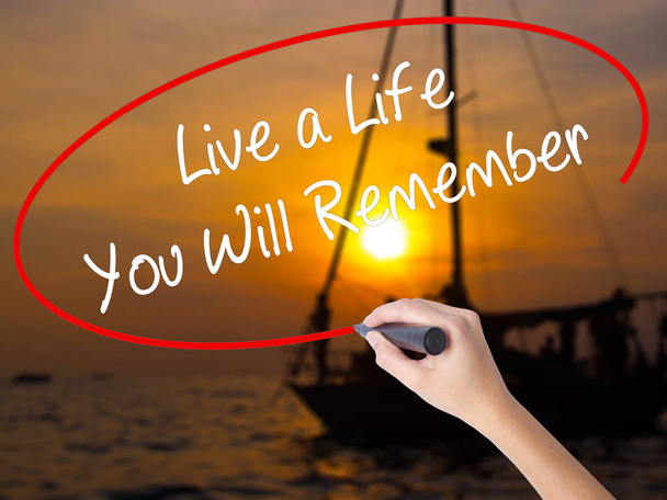 Woman Hand Writing Live a Life You Will Remember with a marker o - Photo, Image