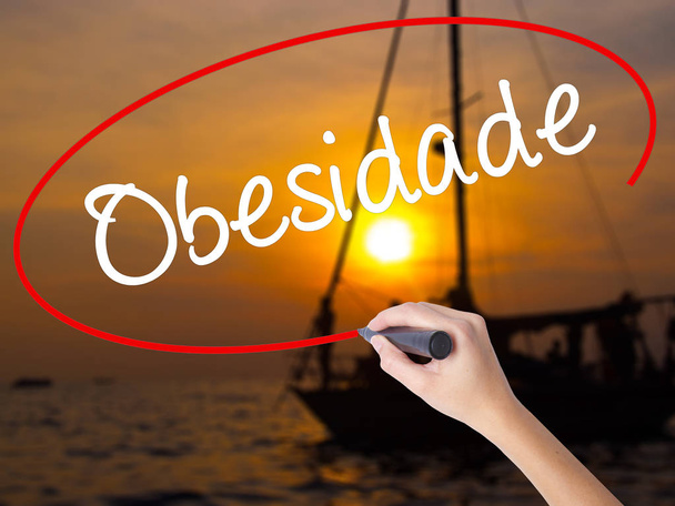 Woman Hand Writing Obesidade (Obesity in Portuguese)  with a mar - Photo, Image