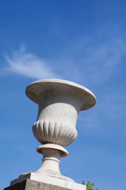 Marble vase against the background of a white cloud, blue sky, Vorontsov Palace, Alupka, Crimea  - Photo, Image