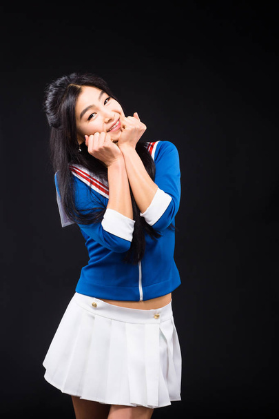 Asian woman expressing emotions in studio - Foto, afbeelding