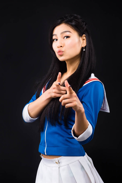 Asian woman expressing emotions in studio - Фото, зображення