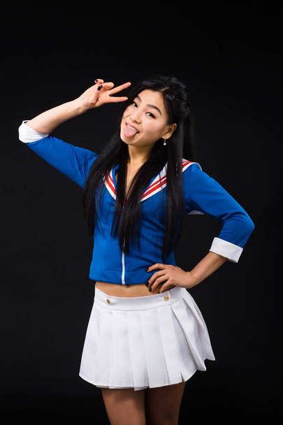 Asian woman expressing emotions in studio - Foto, afbeelding