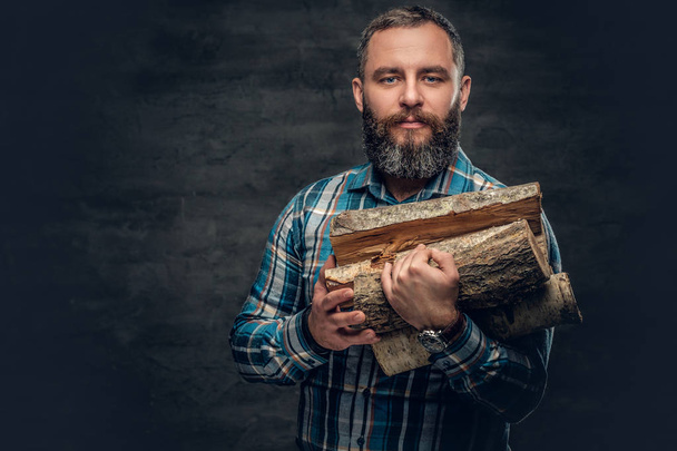Man holding firewood - Photo, Image