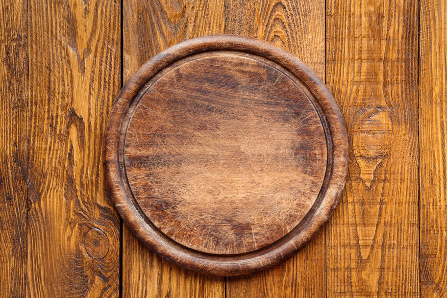 Дерев'яна кругла дошка для піци
 - Фото, зображення