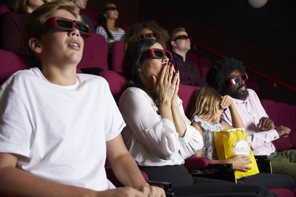 Audience In Cinema Watching Horror Film - 写真・画像