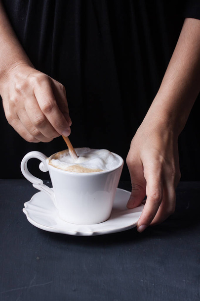 hand holding a cup of coffee, latte - Photo, image